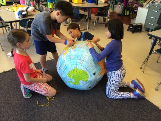 Second graders learn about geography by analyzing different maps